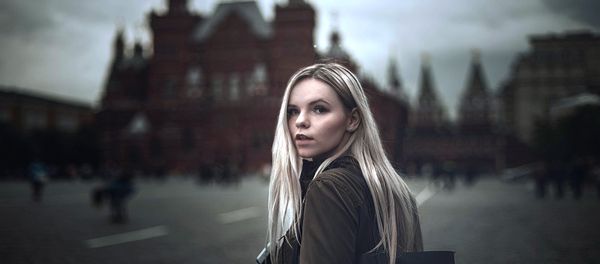 A young woman walking on the Red Square in Moscow A young woman walking on the Red Square in Moscow - Sputnik International