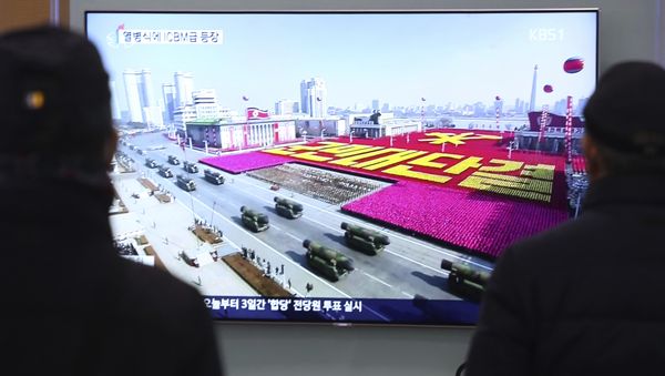 People watch a TV showing North Korea's missiles during a military parade in Pyongyang, North Korea, at Seoul Railway Station in Seoul, South Korea, Thursday, Feb. 8, 2018 People watch a TV showing North Korea's missiles during a military parade in Pyongyang, North Korea, at Seoul Railway Station in Seoul, South Korea, Thursday, Feb. 8, 2018 - Sputnik International