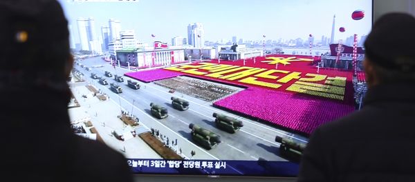 People watch a TV showing North Korea's missiles during a military parade in Pyongyang, North Korea, at Seoul Railway Station in Seoul, South Korea, Thursday, Feb. 8, 2018 - Sputnik International