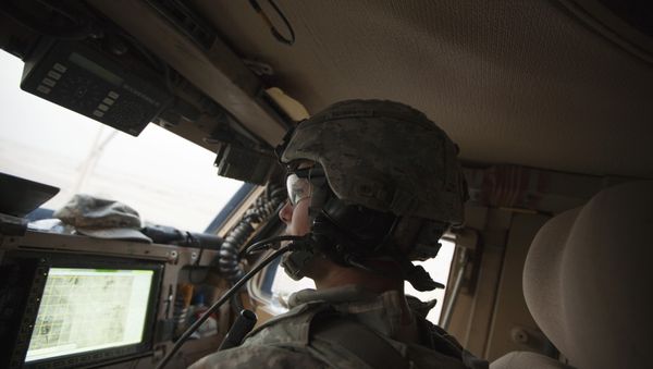 In Dec. 16, 2011 photo, Sergeant Daniel Martin watches the road and a GPS device inside his unit's Mine Resistant Ambush Protected vehicle during the US military's last combat patrol in Iraq In Dec. 16, 2011 photo, Sergeant Daniel Martin watches the road and a GPS device inside his unit's Mine Resistant Ambush Protected vehicle during the US military's last combat patrol in Iraq - Sputnik International