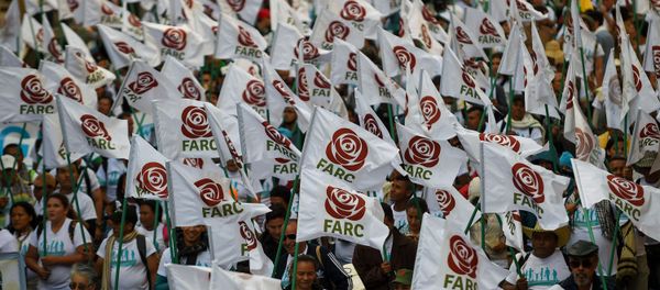 FARC members and supporters wave flags with the new logo of the rebaptized FARC (Common Alternative Revolutionary Force), transformed into a political party following its disarmament, during the closing of their National Congress in Bogota. (File) - Sputnik International