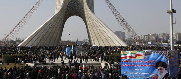 Iranians take part in a rally marking the anniversary of the 1979 Islamic revolution, on February 11, 2018 in the capital Tehran - Sputnik International