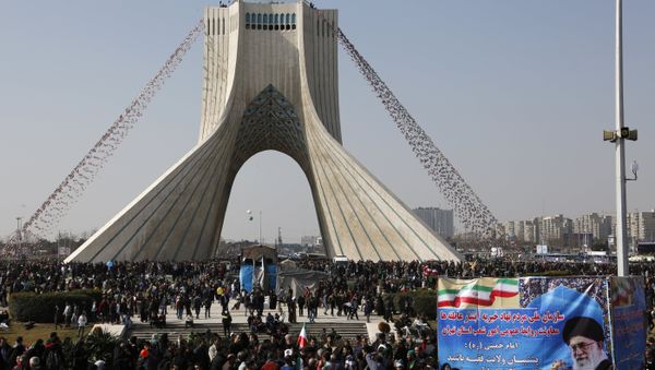 Iranians take part in a rally marking the anniversary of the 1979 Islamic revolution, on February 11, 2018 in the capital Tehran - Sputnik International