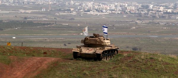An old military vehicle can be seen positioned on the Israeli side of the border with Syria, near the Druze village of Majdal Shams in the Israeli-occupied Golan Heights, Israel February 11, 2018 An old military vehicle can be seen positioned on the Israeli side of the border with Syria, near the Druze village of Majdal Shams in the Israeli-occupied Golan Heights, Israel February 11, 2018 - Sputnik International