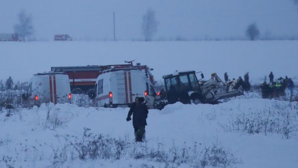 Emergency services work at the scene where a short-haul regional Antonov AN-148 plane crashed after taking off from Moscow's Domodedovo airport, outside Moscow, Russia February 11, 2018 - Sputnik International
