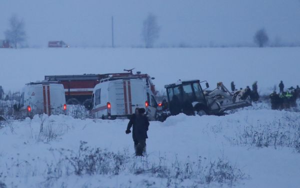 Emergency services work at the scene where a short-haul regional Antonov AN-148 plane crashed after taking off from Moscow's Domodedovo airport, outside Moscow, Russia February 11, 2018 - Sputnik International