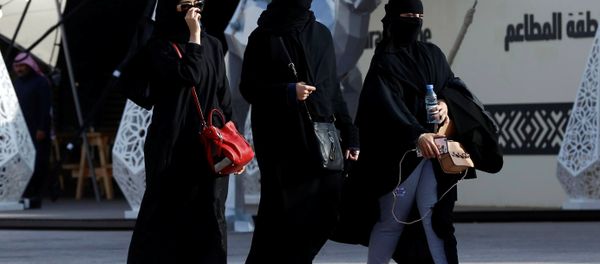 People walk during King Abdulaziz Camel Festival in Rimah Governorate, north-east of Riyadh, Saudi Arabia January 19, 2018. People walk during King Abdulaziz Camel Festival in Rimah Governorate, north-east of Riyadh, Saudi Arabia January 19, 2018. - Sputnik International