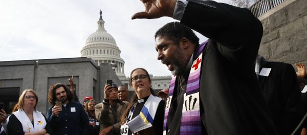 Rev. William Barber II, with the Poor People's Campaign, speaks to the group after they prayed inside of the Capitol Rotunda in protest of the GOP tax overhaul, Monday, Dec. 4, 2017, on Capitol Hill in Washington. Rev. William Barber II, with the Poor People's Campaign, speaks to the group after they prayed inside of the Capitol Rotunda in protest of the GOP tax overhaul, Monday, Dec. 4, 2017, on Capitol Hill in Washington. - Sputnik International