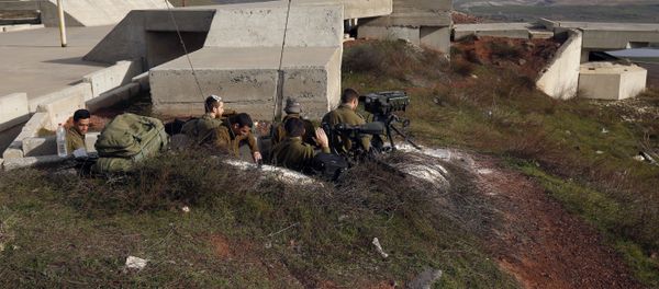 A picture taken on February 10, 2018 show Israeli solders taking positions in the Israeli-occupied Golan Heights near the border with Syria A picture taken on February 10, 2018 show Israeli solders taking positions in the Israeli-occupied Golan Heights near the border with Syria - Sputnik International
