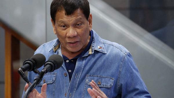 Philippine President Rodrigo Duterte addresses Filipino Overseas Workers who were repatriated from Kuwait, Tuesday, Feb. 13, 2018 at the Ninoy Aquino International Airport in suburban Pasay city southeast of Manila, Philippines Philippine President Rodrigo Duterte addresses Filipino Overseas Workers who were repatriated from Kuwait, Tuesday, Feb. 13, 2018 at the Ninoy Aquino International Airport in suburban Pasay city southeast of Manila, Philippines - Sputnik International