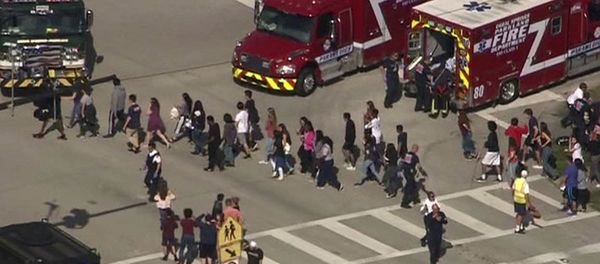 Students are evacuated from Marjory Stoneman Douglas High School during a shooting incident in Parkland, Florida, U.S. February 14, 2018 in a still image from video Students are evacuated from Marjory Stoneman Douglas High School during a shooting incident in Parkland, Florida, U.S. February 14, 2018 in a still image from video - Sputnik International