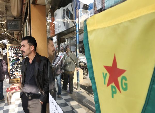 Flag of the Kurdish YPG self-defense forces on the central street of the city of Afrin, Syria - Sputnik International