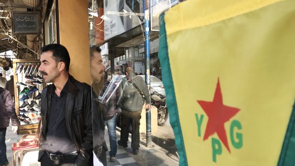 Flag of the Kurdish YPG self-defense forces on the central street of the city of Afrin, Syria - Sputnik International