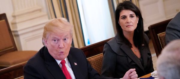 US President Donald Trump (C) speaks, watched by US Ambassador to the UN Nikki Haley, during lunch with members of the United Nations Security Council in the State Dining Room of the White House in Washington, DC - Sputnik International