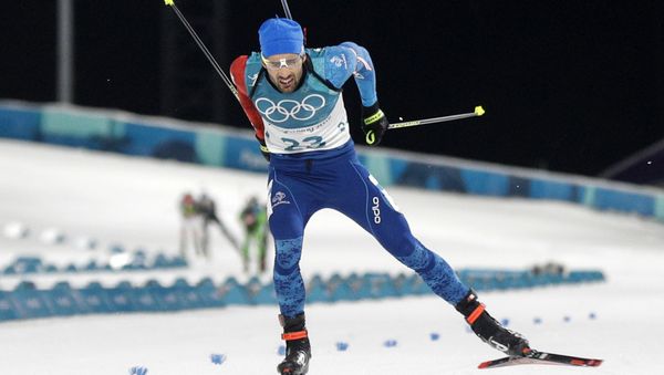 Martin Fourcade, of France, skis across the finish line during the men's 20-kilometer individual biathlon at the 2018 Winter Olympics in Pyeongchang, South Korea - Sputnik International