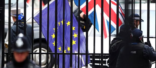 A demonstrator carries a Union Jack and a European Union flag as the EU's chief Brexit negotiator Michel Barnier visits Downing Street in London, Britain A demonstrator carries a Union Jack and a European Union flag as the EU's chief Brexit negotiator Michel Barnier visits Downing Street in London, Britain - Sputnik International