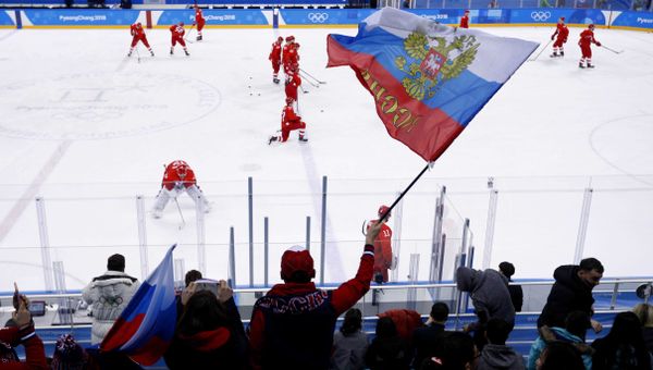 A Russian fan waves a flag before the ice hockey game between teams of Russia and the US at the 2018 Winter Olympics, February 17, 2018 - Sputnik International