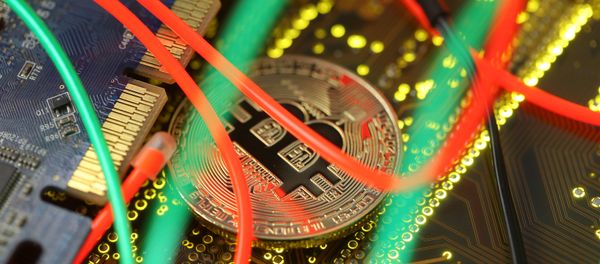 Representation of the Bitcoin virtual currency standing on the PC motherboard is seen in this illustration picture, February 3, 2018 Representation of the Bitcoin virtual currency standing on the PC motherboard is seen in this illustration picture, February 3, 2018 - Sputnik International