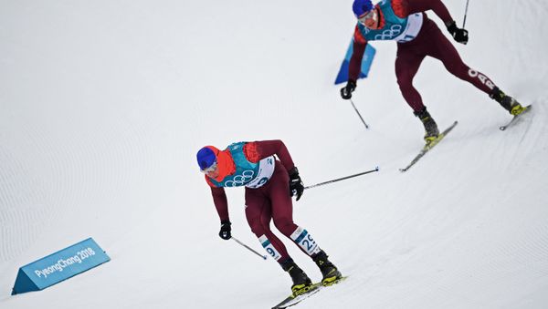 Russian athletes Andrei Melnichenko, left, and Andrei Larkov during the skiathlon event in men's cross-country skiing at the 2018 Winter Olympics in Pyeongchang. - Sputnik International
