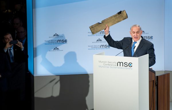 Israeli Prime Minister Benjamin Netanyahu holds up a remnant of what he said was a piece of Iranian drone which was shot down in Israeli airspace during his speech at the Munich Security Conference, Germany February 18, 2018 - Sputnik International