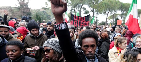 Demonstrators march during an anti-racism rally in Macerata, Italy, February 10, 2018 Demonstrators march during an anti-racism rally in Macerata, Italy, February 10, 2018 - Sputnik International