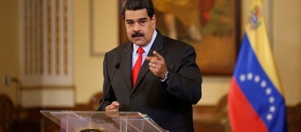 Venezuela's President Nicolas Maduro gestures as he talks to the media during a news conference in Caracas, Venezuela February 15, 2018 - Sputnik International