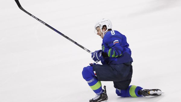 Ice Hockey - Pyeongchang 2018 Winter Olympics - Men's Preliminary Round Match - Slovenia v Slovakia - Kwandong Hockey Centre, Gangneung, South Korea - February 17, 2018 - Ziga Jeglic of Slovenia celebrates after scoring the winning goal in a penalty shoot-out against Slovakia. - Sputnik International