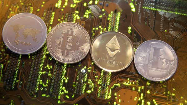 Representations of the Ripple, Bitcoin, Etherum and Litecoin virtual currencies are seen on a PC motherboard in this illustration picture, February 13, 2018. Picture is taken February 13, 2018 - Sputnik International