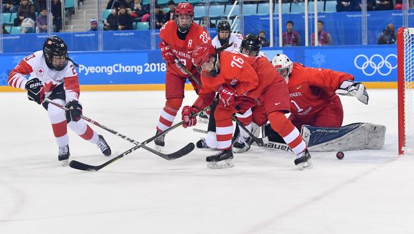From left: Sarah Nurse (Canada) and Maria Batalova and Yekaterina Nikolayeva and goalie Valeria Tarakanova (Russia) during the semifinals between Canada and Russia in the women's ice hockey tournament at the 2018 Winter Olympics - Sputnik International