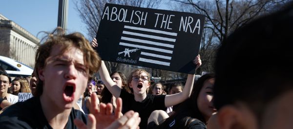 Sydney Acuff, 16, of Silver Spring, Md., center, screams during a student protest for gun control legislation in front of the White House, Wednesday, Feb. 21, 2018, in Washington. Sydney Acuff, 16, of Silver Spring, Md., center, screams during a student protest for gun control legislation in front of the White House, Wednesday, Feb. 21, 2018, in Washington. - Sputnik International