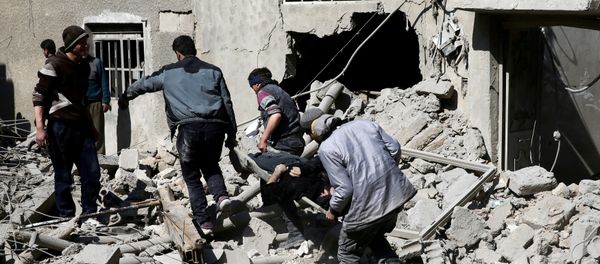 People carry the body of Majid Santiha on a stretcher in the besieged eastern Ghouta town of Hamouriyeh near Damascus, Syria People carry the body of Majid Santiha on a stretcher in the besieged eastern Ghouta town of Hamouriyeh near Damascus, Syria - Sputnik International