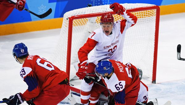 Vojtech Mozik (Czech Republic) and Kirill Kaprizov (Russia), right to left, during the semifinals between the Russia and Czech Republic national teams in the men’s ice hockey tournament, at the XXIII Olympic Winter Games Vojtech Mozik (Czech Republic) and Kirill Kaprizov (Russia), right to left, during the semifinals between the Russia and Czech Republic national teams in the men’s ice hockey tournament, at the XXIII Olympic Winter Games - Sputnik International