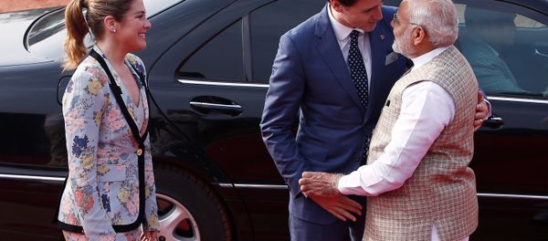 Canadian Prime Minister Justin Trudeau (C) hugs his Indian counterpart Narendra Modi as his wife Sophie Gregoire (L) looks on during Trudeau's ceremonial reception in New Delhi, India, February 23, 2018. Canadian Prime Minister Justin Trudeau (C) hugs his Indian counterpart Narendra Modi as his wife Sophie Gregoire (L) looks on during Trudeau's ceremonial reception in New Delhi, India, February 23, 2018. - Sputnik International