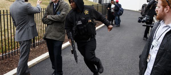 A Secret Service officer rushes past reporters after a vehicle rammed into a security barrier near the White House, Friday, Feb. 23, 2018, in Washington. A Secret Service officer rushes past reporters after a vehicle rammed into a security barrier near the White House, Friday, Feb. 23, 2018, in Washington. - Sputnik International