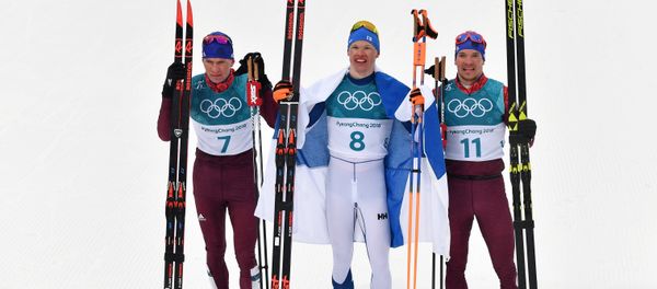 Medalists in the 50-km mass start race in men’s cross-country skiing at the XXIII Olympic Winter Games in Pyeongchang, from left: Alexander Bolshunov (Russia) - silver medal; Iivo Niskanen (Finland) - gold medal; and Andrei Larkov (Russia) - bronze medal - Sputnik International