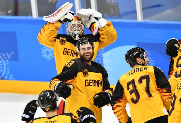 Germany's hockey players celebrate their victory in the semifinals between the Canada and Germany national teams in the men’s ice hockey tournament, at the XXIII Olympic Winter Games - Sputnik International