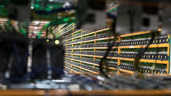 A wall of miners, is seen through a new installation, at the cryptocurrency farming operation (File) A wall of miners, is seen through a new installation, at the cryptocurrency farming operation (File) - Sputnik International
