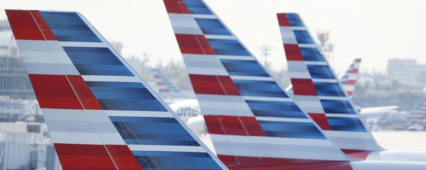 Painted vertical stabilizers are viewed as American Airlines jets are parked on the airport apron, Monday, Nov. 6, 2017, at Miami International Airport in Miami. American Airlines and a subsidiary will pay $9.8 million in stock to settle claims that they failed to help disabled employees return to work. Painted vertical stabilizers are viewed as American Airlines jets are parked on the airport apron, Monday, Nov. 6, 2017, at Miami International Airport in Miami. American Airlines and a subsidiary will pay $9.8 million in stock to settle claims that they failed to help disabled employees return to work. - Sputnik International