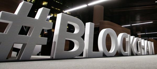 Giant letters, reading the word blockchain are displayed at the blockchain centre, which aims at boosting start-ups, on February 7, 2018 in Lithuania's capital Vilnius - Sputnik International