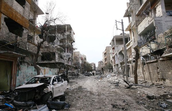 Damaged cars and buildings are seen in the besieged town of Douma, Eastern Ghouta, Damascus, Syria Damaged cars and buildings are seen in the besieged town of Douma, Eastern Ghouta, Damascus, Syria - Sputnik International