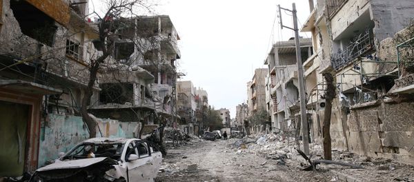 Damaged cars and buildings are seen in the besieged town of Douma, Eastern Ghouta, Damascus, Syria - Sputnik International