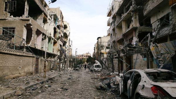 Damaged buildings are seen in the besieged town of Douma, Eastern Ghouta, Damascus, Syria February 25, 2018 - Sputnik International