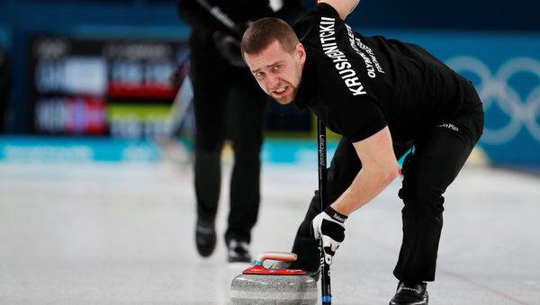 Curling Pyeongchang 2018 Winter Olympics Mixed Doubles Bronze Medal Match - Olympic Athletes from Russia v Norway - Gangneung Curling Center - Gangneung, South Korea February 13, 2018 - Alexander Krushelnitsky, an Olympic athlete from Russia, sweeps - Sputnik International