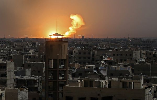 A picture taken on February 28, 2018 shows flames erupting in the horizon following a reported rocket attack in al-Shaffuniyah, in the enclave of Eastern Ghouta on the outskirts of the Syrian capital Damascus A picture taken on February 28, 2018 shows flames erupting in the horizon following a reported rocket attack in al-Shaffuniyah, in the enclave of Eastern Ghouta on the outskirts of the Syrian capital Damascus - Sputnik International