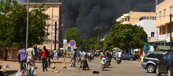 People watch as black smoke rises as the capital of Burkina Faso came under multiple attacks on March 2, 2018, targeting the French embassy, the French cultural centre and the country's military headquarters People watch as black smoke rises as the capital of Burkina Faso came under multiple attacks on March 2, 2018, targeting the French embassy, the French cultural centre and the country's military headquarters - Sputnik International