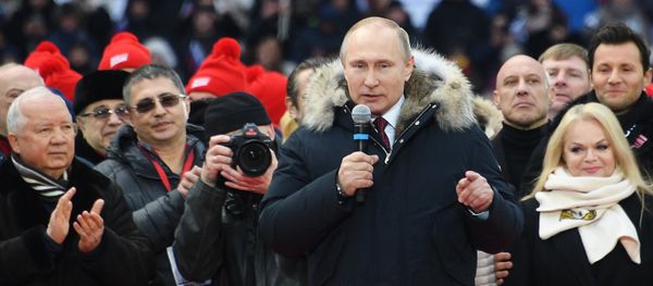 Russian President Putin delivers a speech during a rally to support his bid in the upcoming presidential election at Luzhniki Stadium in Moscow - Sputnik International