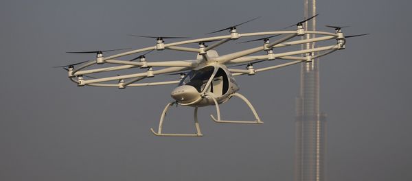 In this Sept. 26, 2017 photo, a Volocopter prototype flies in front of the Burj Khalifa, the world's tallest tower, during a test flight in Dubai, United Arab Emirates - Sputnik International