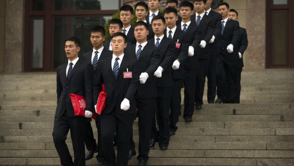 Security officials march in formation as they leave after the opening session of the Chinese People's Political Consultative Conference (CPPCC) held in Beijing's Great Hall of the People, Saturday, March 3, 2018. - Sputnik International