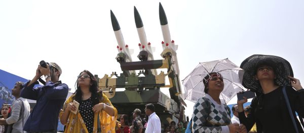 Spectators stand next to the models of Akash, surface-to-air missile, as they watch fighter aircraft perform on the fourth day of Aero India 2017 at Yelahanka air base in Bangalore, India, Friday, Feb. 17, 2017 Spectators stand next to the models of Akash, surface-to-air missile, as they watch fighter aircraft perform on the fourth day of Aero India 2017 at Yelahanka air base in Bangalore, India, Friday, Feb. 17, 2017 - Sputnik International