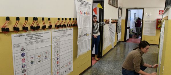 Women post electoral posters at a polling station on March 3, 2018 in Milan Women post electoral posters at a polling station on March 3, 2018 in Milan - Sputnik International